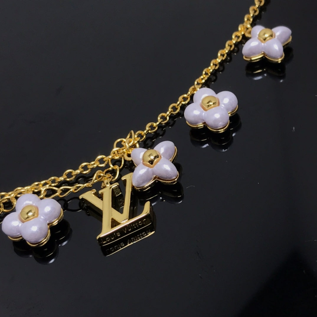 LUXEIFY LOGO 6 MOTIF STAR AND SUN GOLD BRACELET