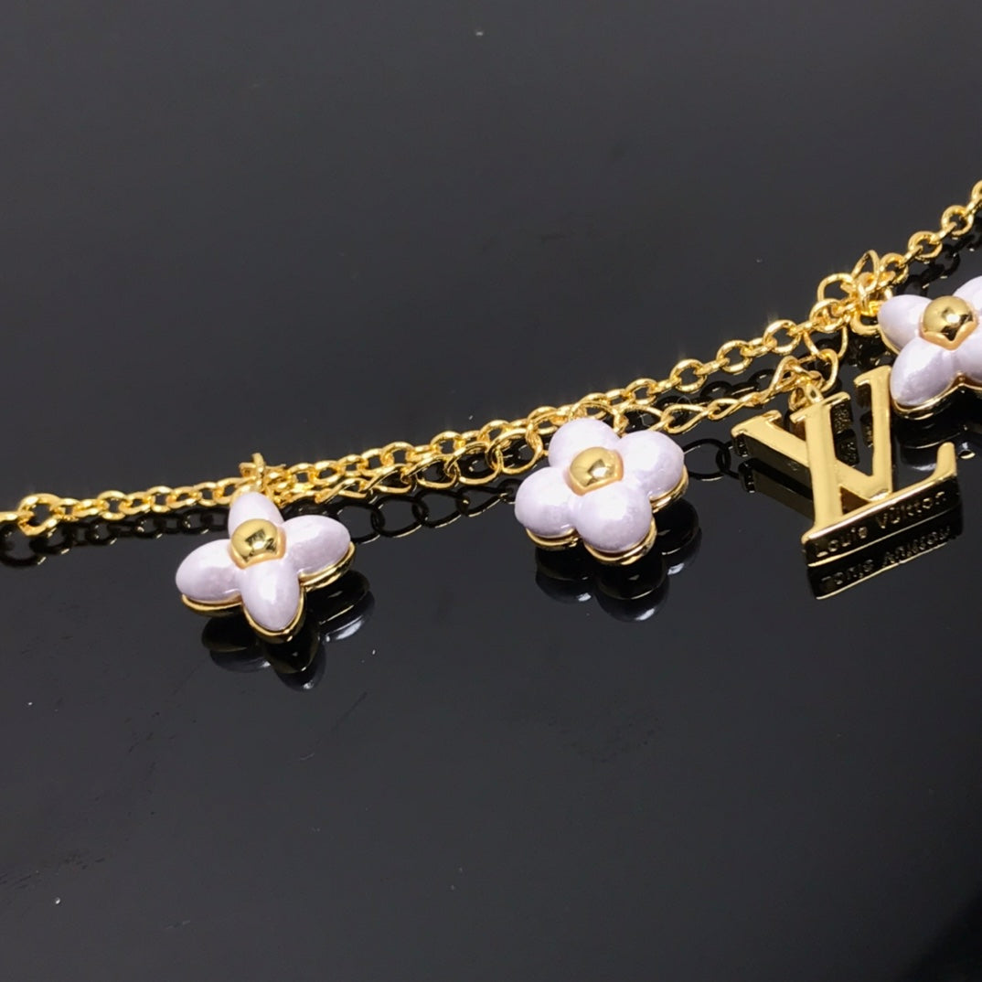 LUXEIFY LOGO 6 MOTIF STAR AND SUN GOLD BRACELET
