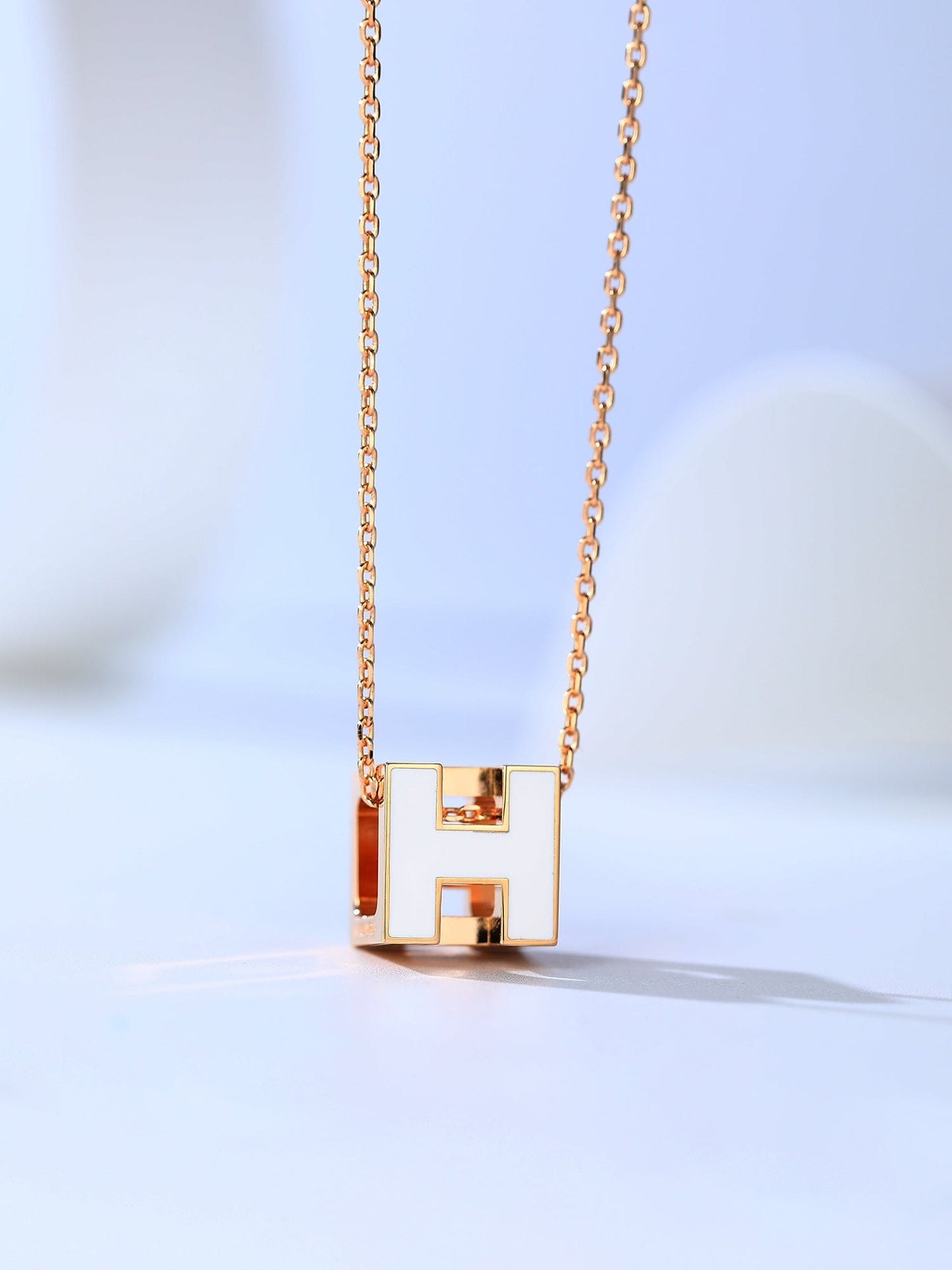 LUXEIFY H CAGE PINK GOLD NECKLACE