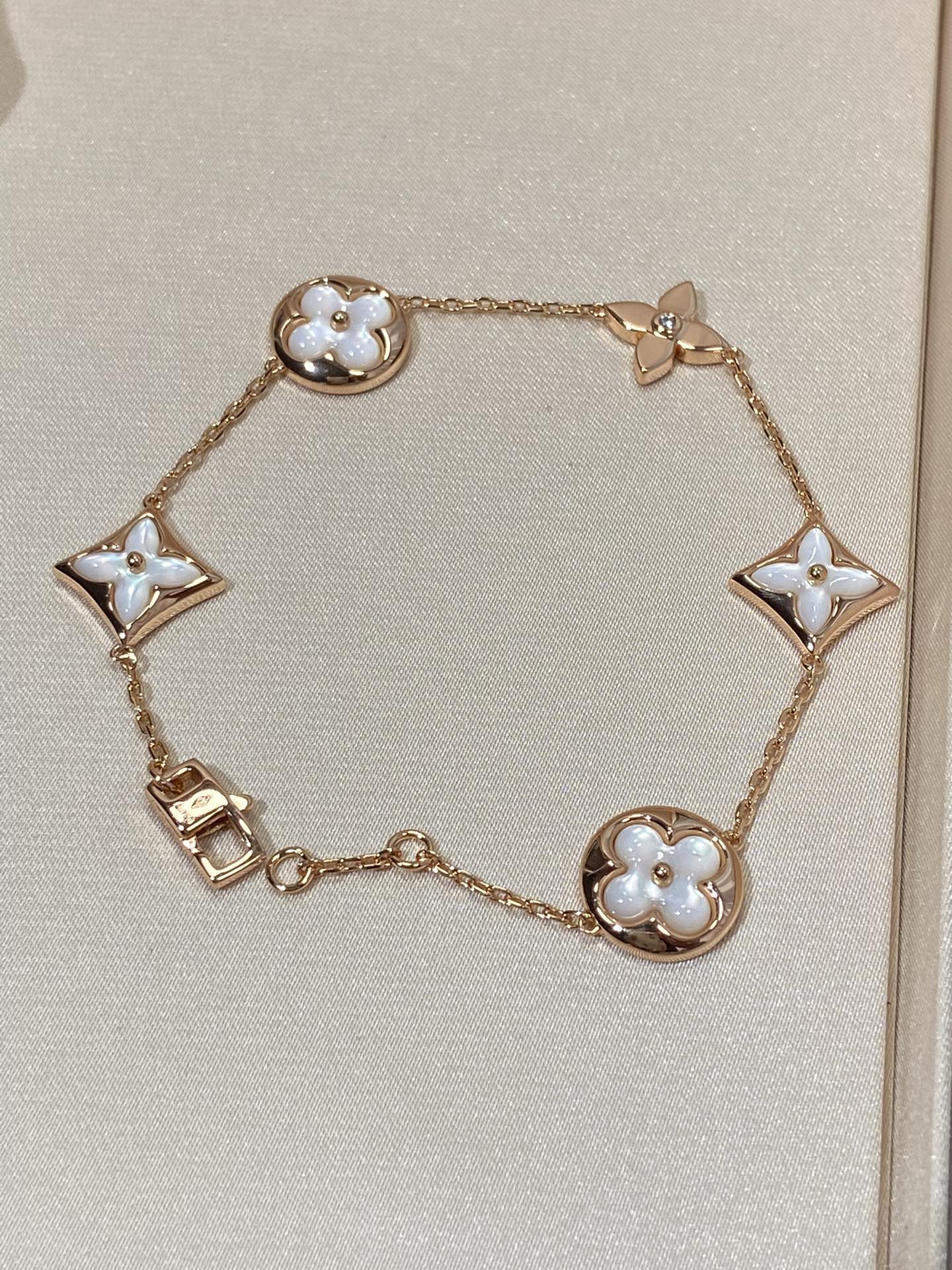 LUXEIFY STAR AND SUN 5 MOTIF MOP PINK GOLD BRACELET