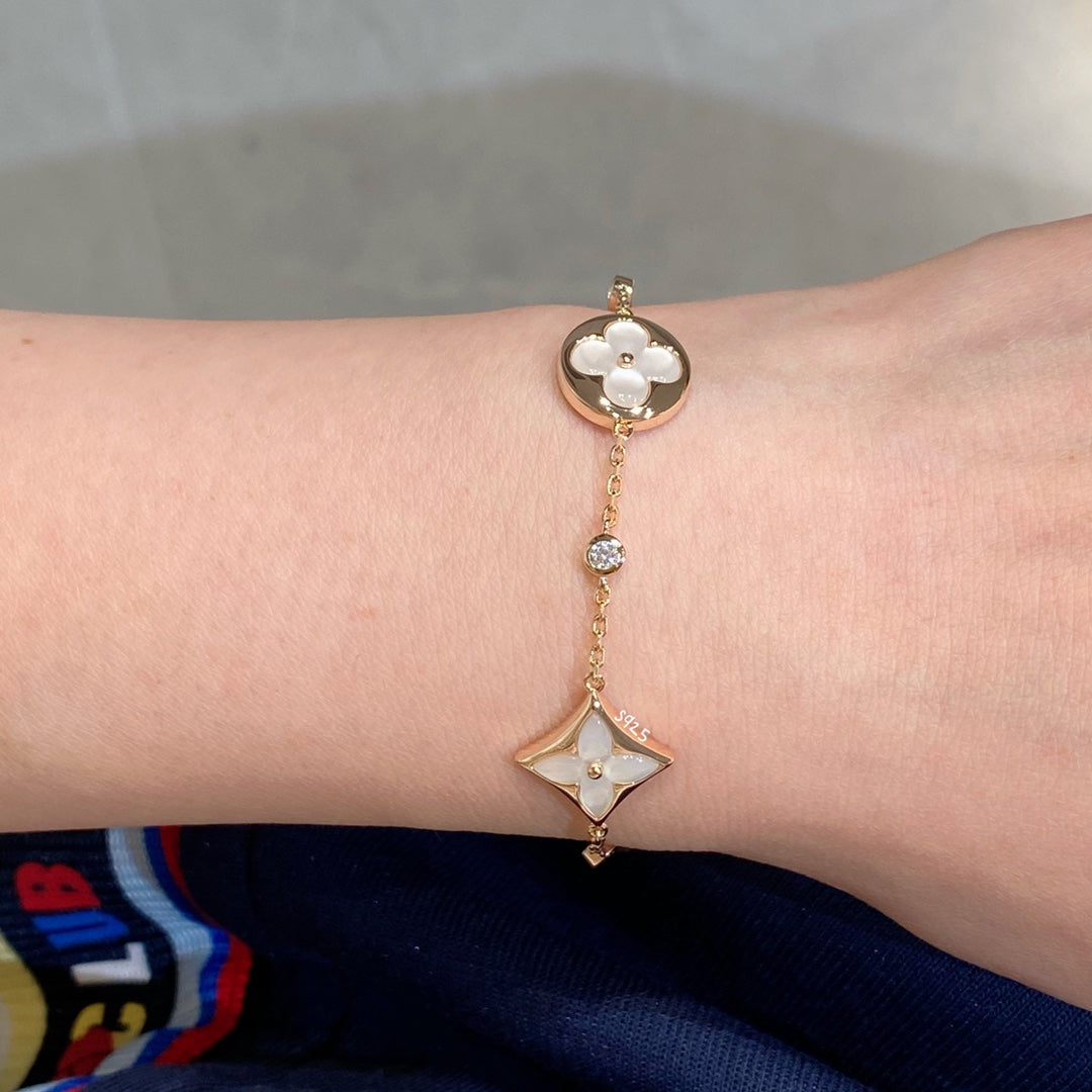 LUXEIFY STAR AND SUN 4 MOTIF WHITE MOP PINK GOLD BRACELET