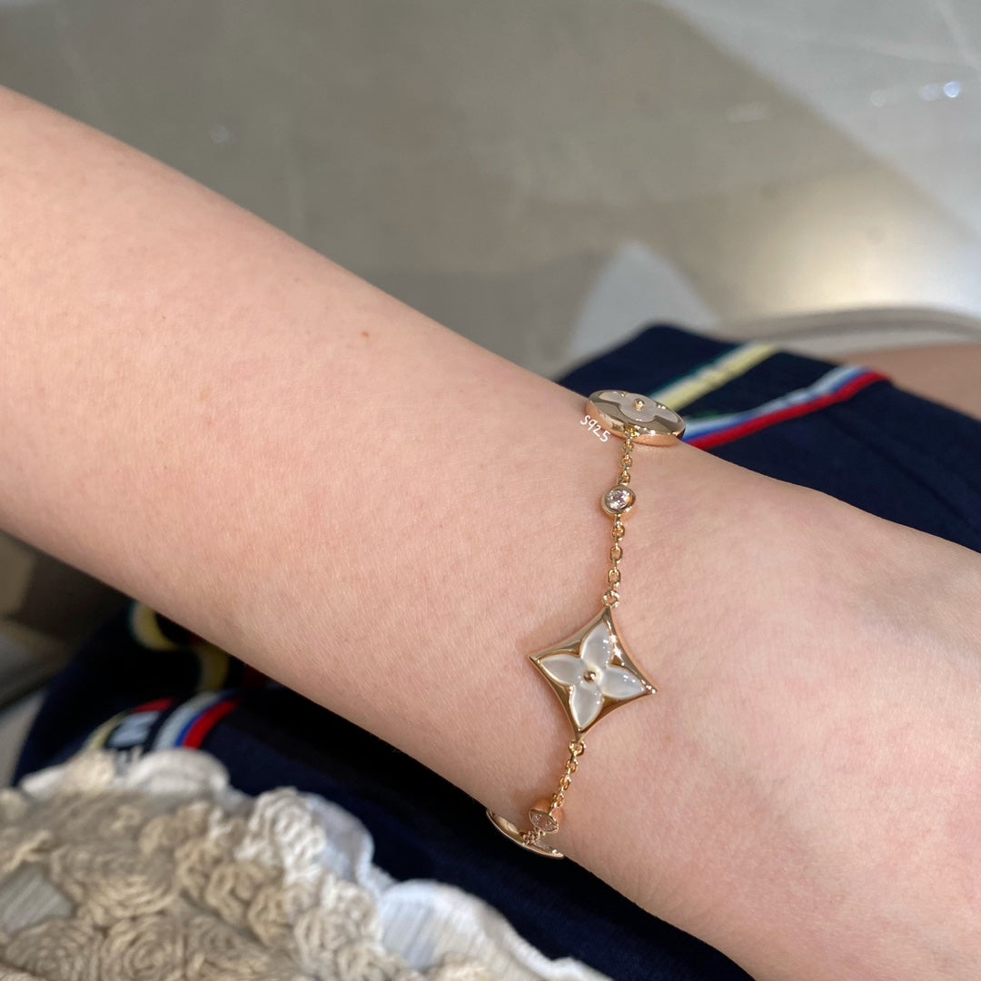 LUXEIFY STAR AND SUN 4 MOTIF WHITE MOP PINK GOLD BRACELET
