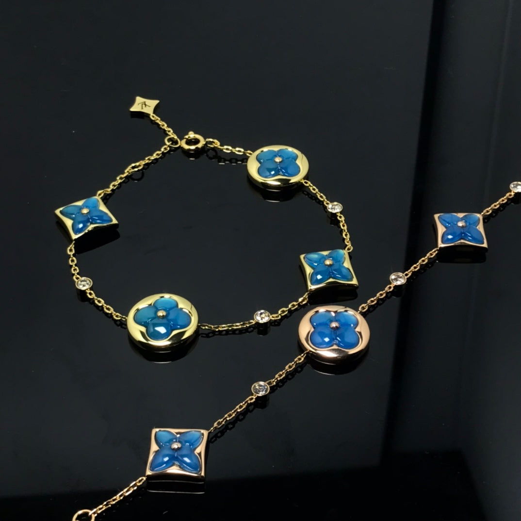 LUXEIFY STAR AND SUN 4 MOTIF BLUE BRACELET