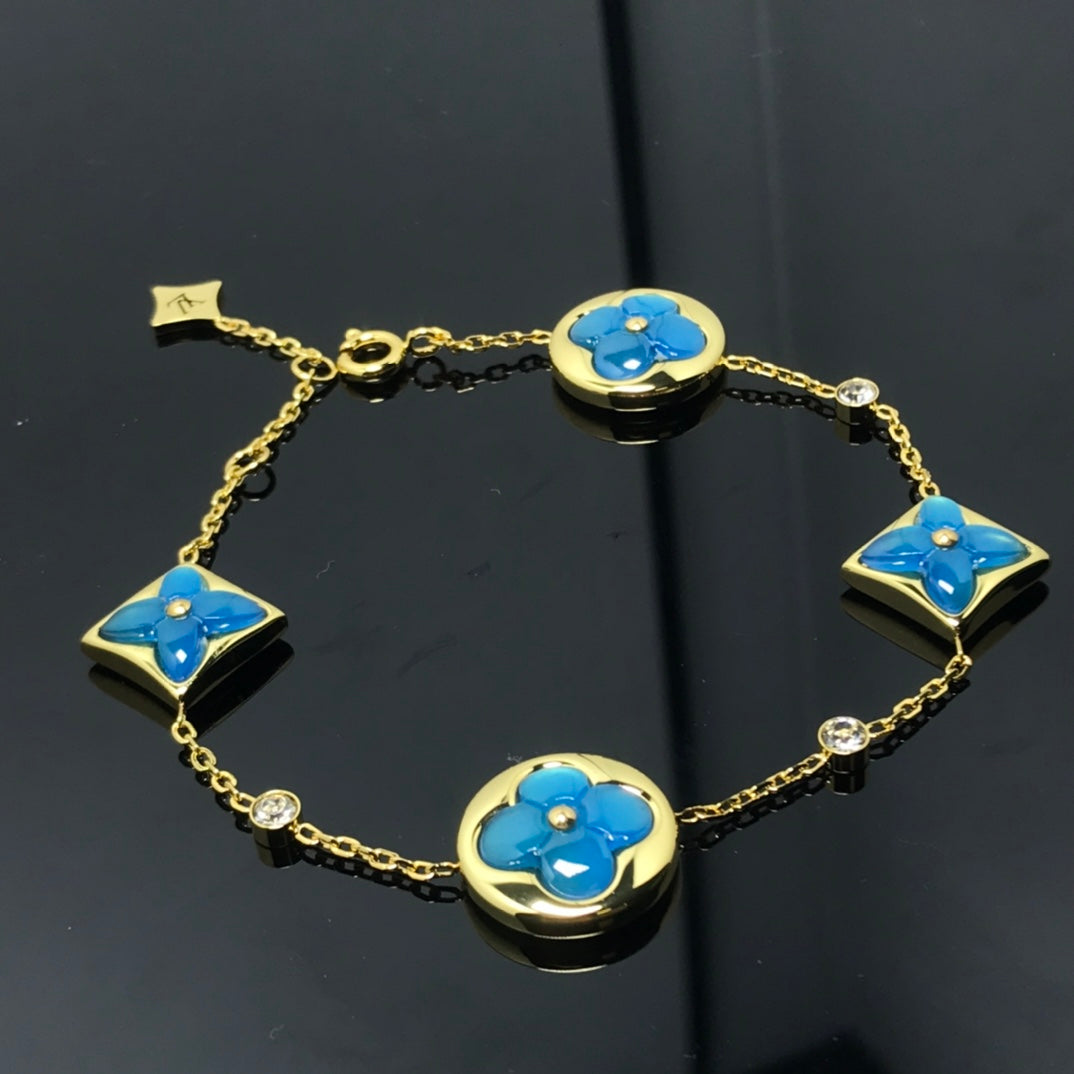 LUXEIFY STAR AND SUN 4 MOTIF BLUE BRACELET