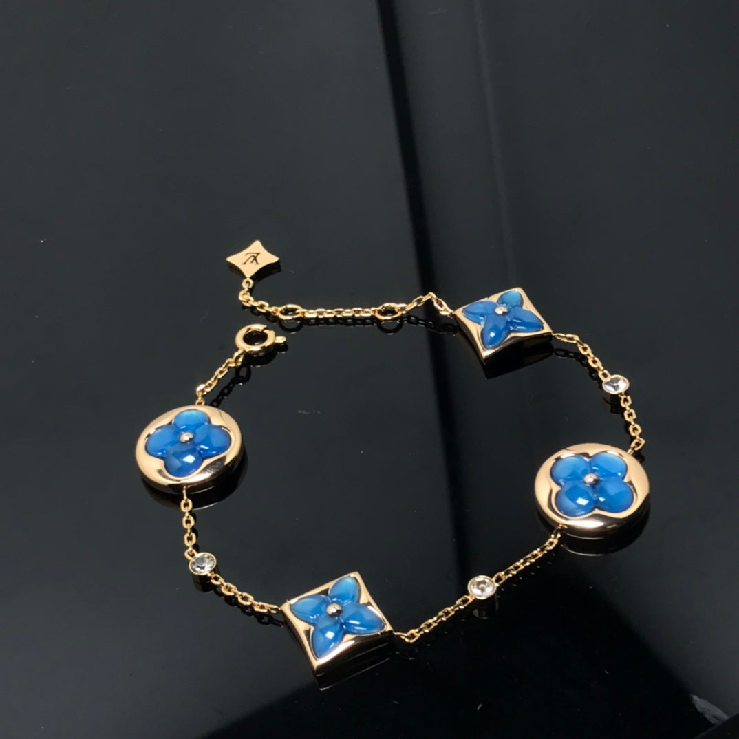 LUXEIFY STAR AND SUN 4 MOTIF BLUE BRACELET