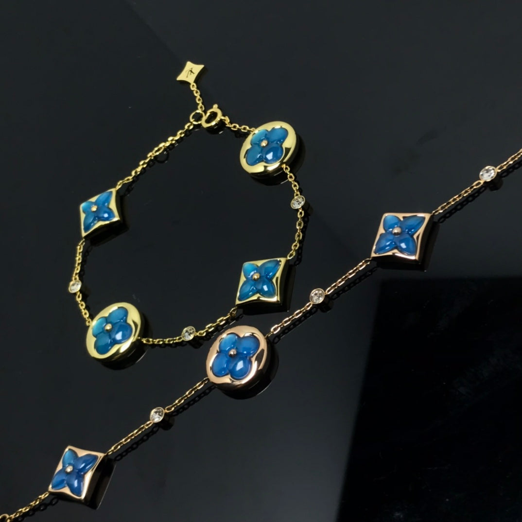 LUXEIFY STAR AND SUN 4 MOTIF BLUE BRACELET